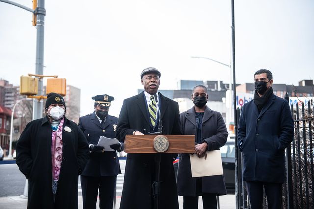 Mayor Adams outside at a lectern, with Police Commissioner Sewell, DOT COmmissioner Rodriguez, NYPD CHief of Transit Kim Royster